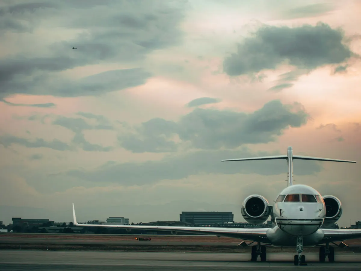 Light jet on a ramp under a stormy sky