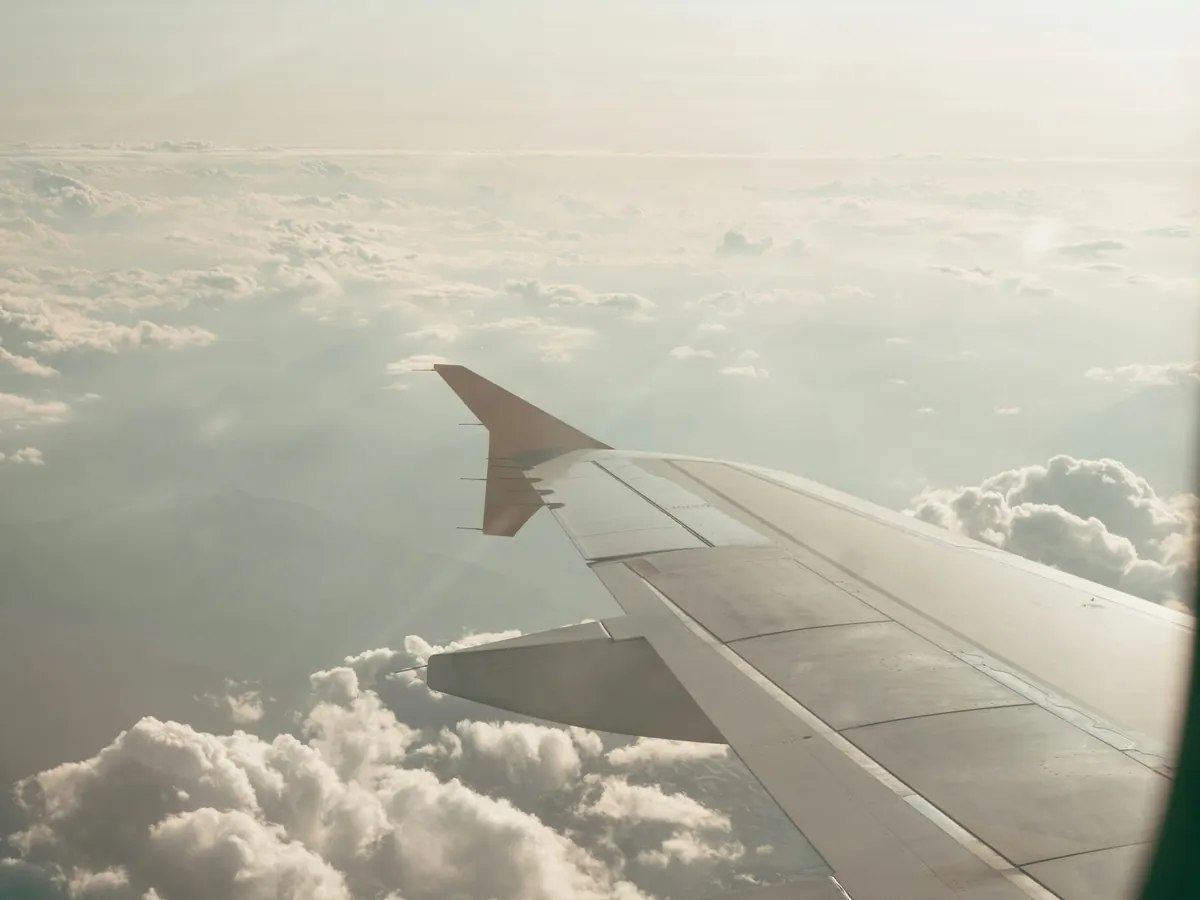 Wing above a sea of cloud